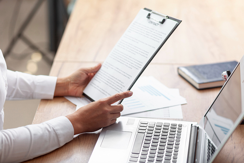 business woman reviewing contract document translation by free document translator online software