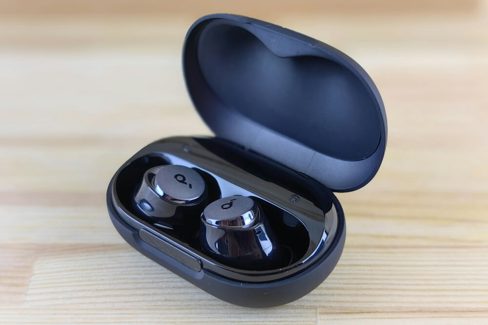 wireless earbuds black charging case product photography ai before