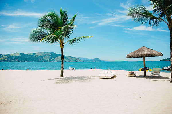 Cleaned tropical beach photo using free AI tool to remove distractions